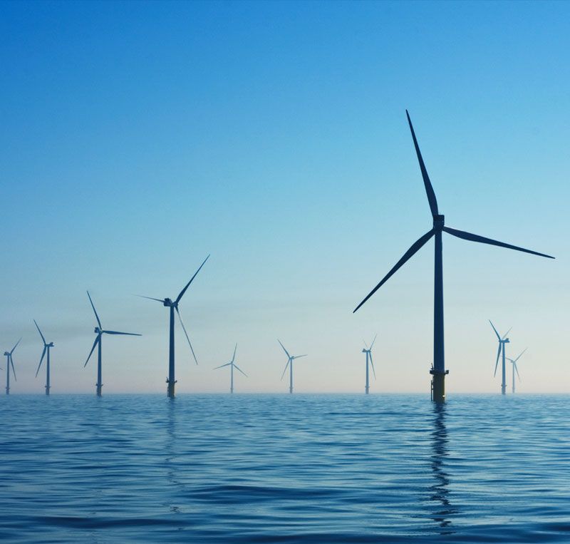 Offshore wind turbines with subsea high-voltage cable terminations